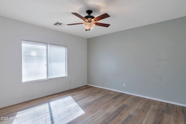 11669 N 165th Ave, Surprise, AZ 85388 - spare room with light wood-type flooring, visible vents, baseboards, and ceiling fan