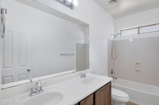 11669 N 165th Ave, Surprise, AZ 85388 - bathroom with double vanity, visible vents, toilet, and a sink