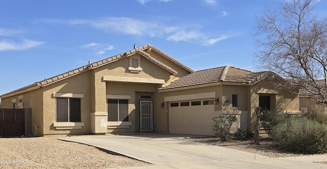 11669 N 165th Ave, Surprise, AZ 85388 - view of front of property with a garage, concrete driveway, stucco siding, and a tile roof
