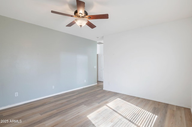 11669 N 165th Ave, Surprise, AZ 85388 - unfurnished room with baseboards, wood finished floors, and ceiling fan