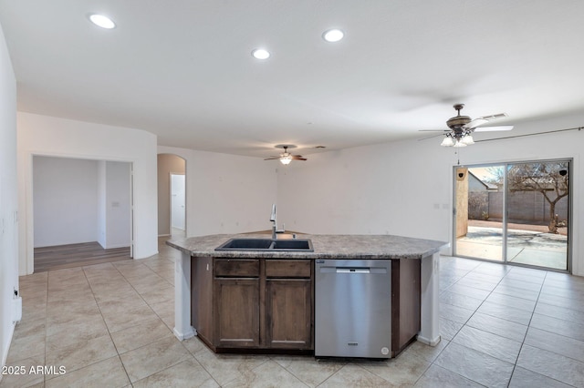 11669 N 165th Ave, Surprise, AZ 85388 - kitchen featuring ceiling fan, dishwasher, an island with sink, arched walkways, and a sink