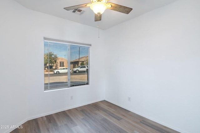 11669 N 165th Ave, Surprise, AZ 85388 - unfurnished room featuring wood finished floors, a ceiling fan, visible vents, and baseboards
