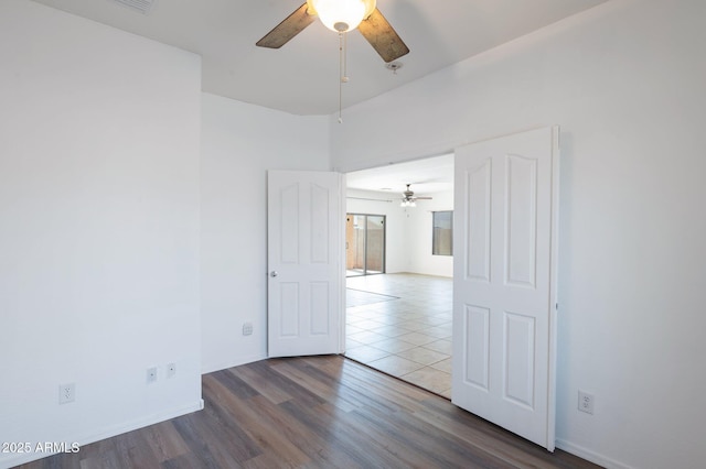 11669 N 165th Ave, Surprise, AZ 85388 - spare room with wood finished floors, a ceiling fan, and baseboards