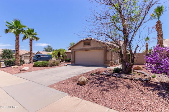 20769 N 106th Ln, Peoria, AZ 85382 - view of front of home with stucco siding, driveway, and a garage
