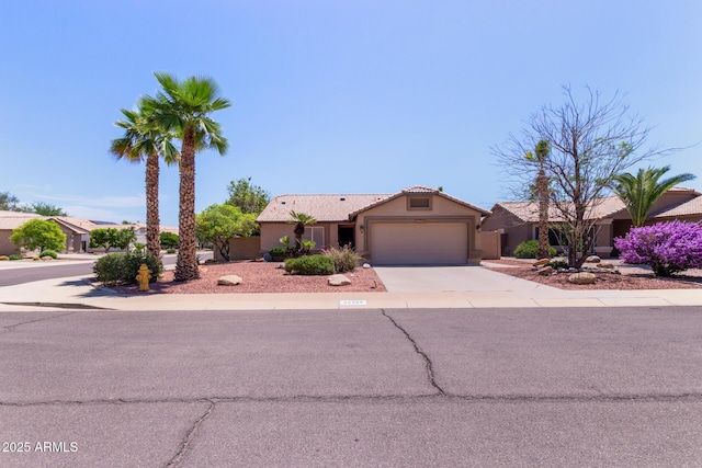 20769 N 106th Ln, Peoria, AZ 85382 - ranch-style home featuring an attached garage, concrete driveway, stucco siding, and a tiled roof