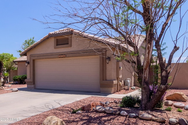 20769 N 106th Ln, Peoria, AZ 85382 - view of front of home featuring a tiled roof, stucco siding, a garage, and driveway