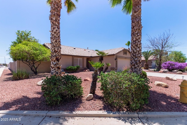 20769 N 106th Ln, Peoria, AZ 85382 - view of front of house featuring a tile roof, a garage, and stucco siding