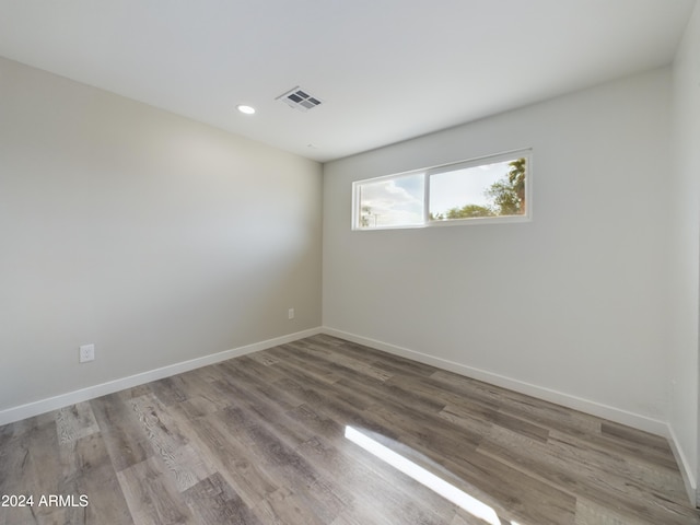 empty room with light hardwood / wood-style floors