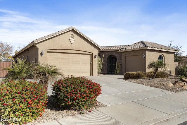 mediterranean / spanish house featuring a garage