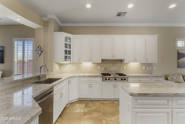 kitchen featuring white cabinetry, stainless steel appliances, light stone countertops, and sink