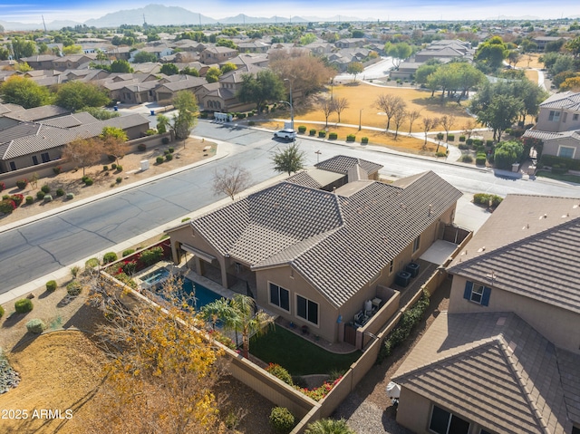 birds eye view of property with a mountain view