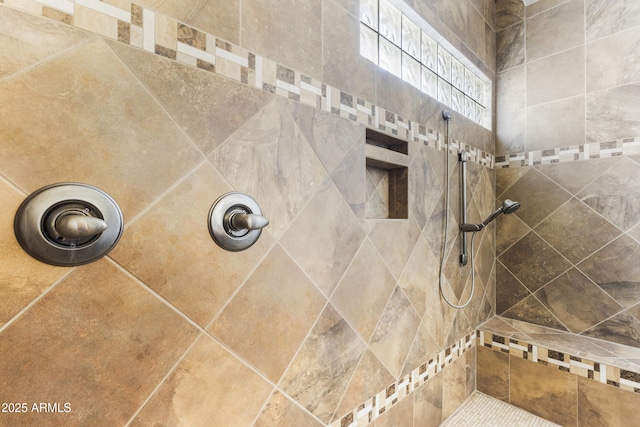 bathroom featuring tiled shower