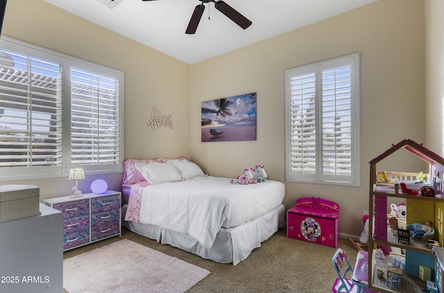 carpeted bedroom with ceiling fan