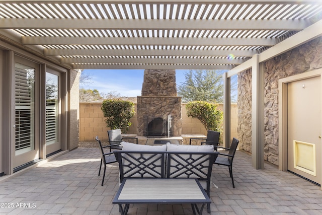 view of patio featuring an outdoor living space with a fireplace and a pergola