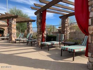 view of patio / terrace featuring fence and a pergola