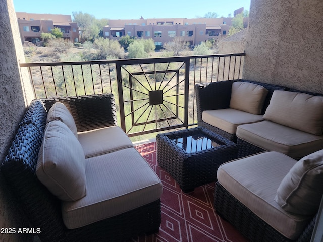 balcony with a residential view and an outdoor hangout area