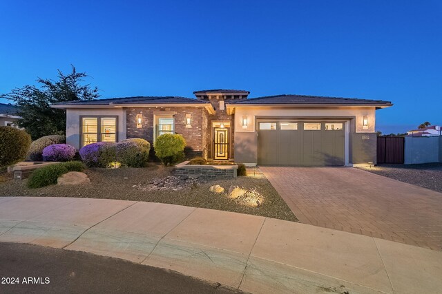 prairie-style house featuring a garage