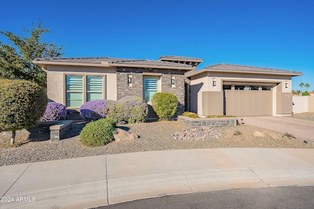 prairie-style house featuring a garage