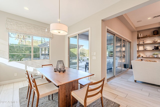 dining space featuring light hardwood / wood-style flooring