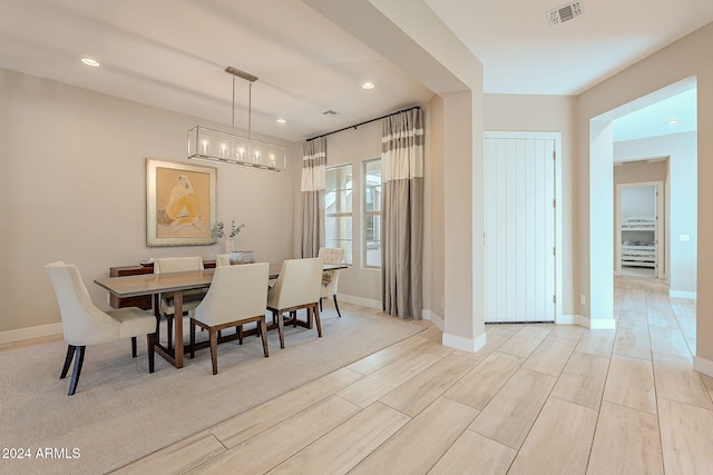 dining area featuring light wood-type flooring