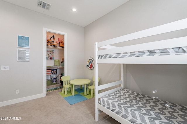 carpeted bedroom featuring a closet