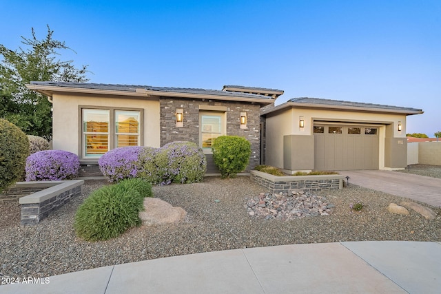 prairie-style home with a garage