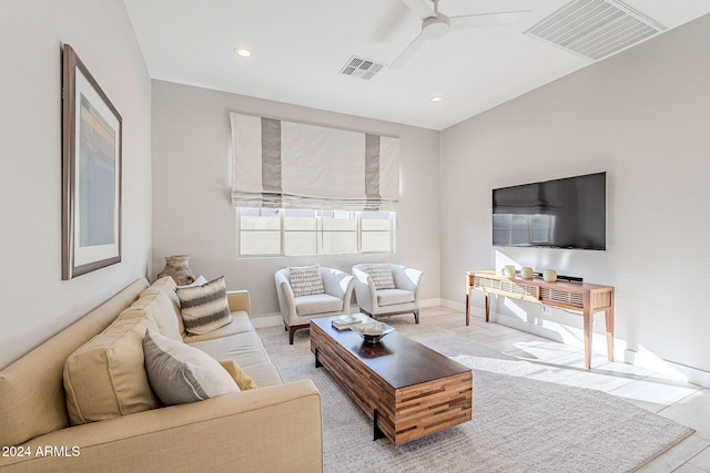 living room with ceiling fan and light tile patterned floors