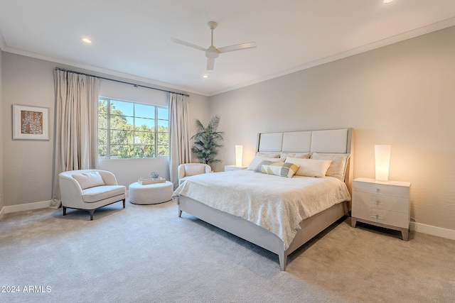 carpeted bedroom with ceiling fan and crown molding