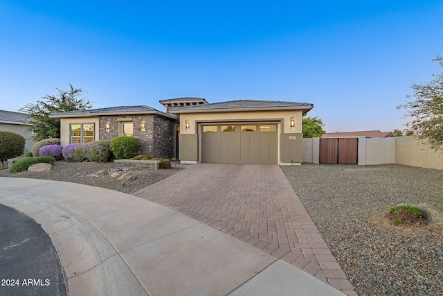 prairie-style house featuring a garage