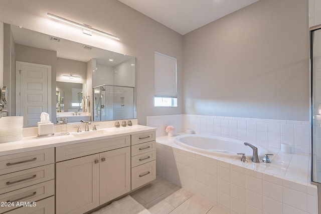 bathroom featuring shower with separate bathtub and vanity