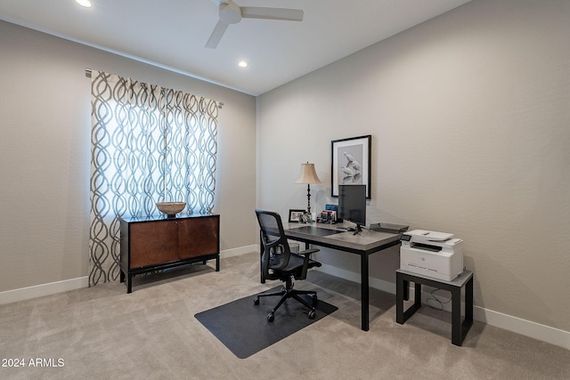 office space with ceiling fan and light carpet