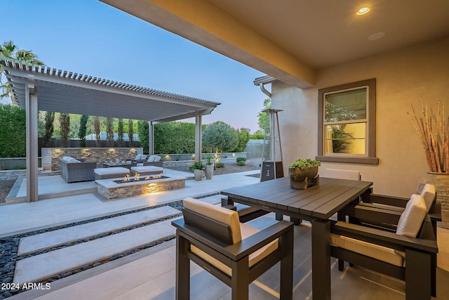 view of patio / terrace featuring an outdoor living space with a fire pit