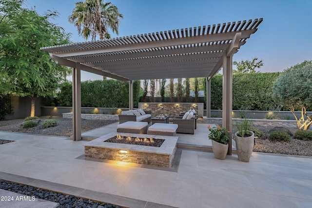 view of patio / terrace featuring an outdoor living space with a fire pit and a pergola