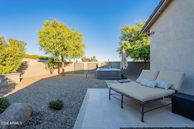 view of patio / terrace with a hot tub