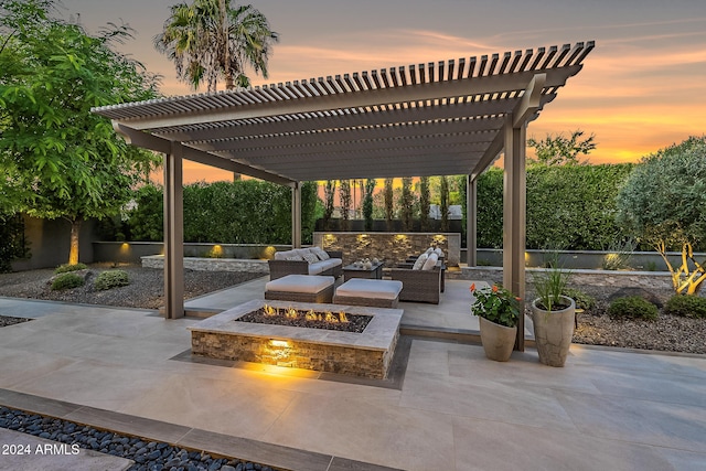 patio terrace at dusk featuring a pergola and an outdoor living space with a fire pit