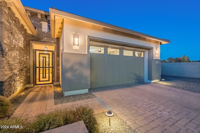 view of exterior entry featuring a garage