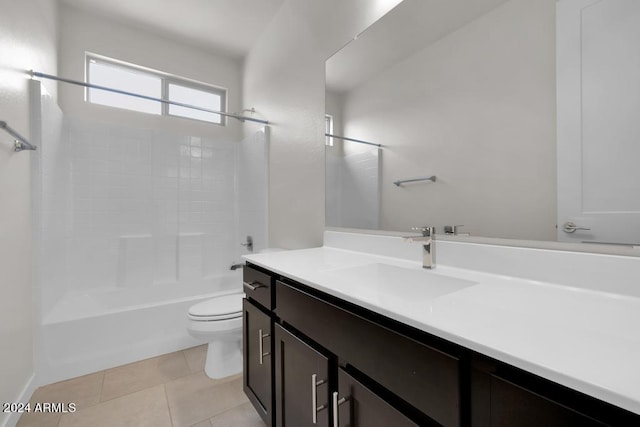bathroom with toilet, vanity, tile patterned floors, and bathtub / shower combination