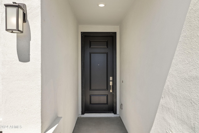 doorway to property with stucco siding