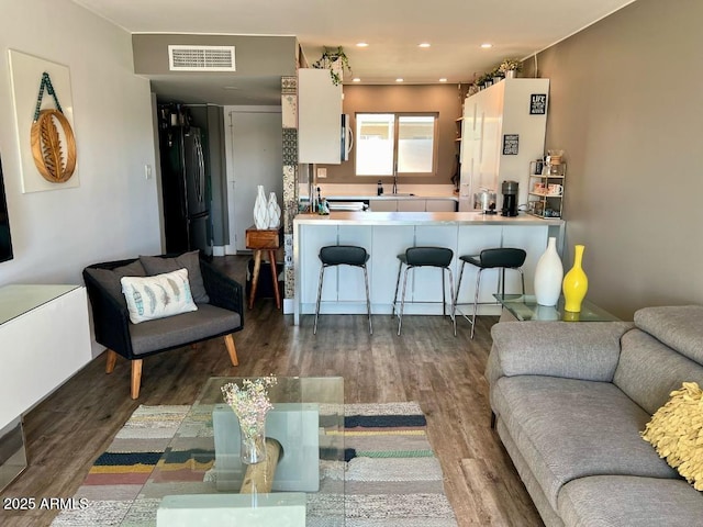 4610 N 68th St N Unit 476, Scottsdale, AZ 85251 - living room featuring wood finished floors and recessed lighting