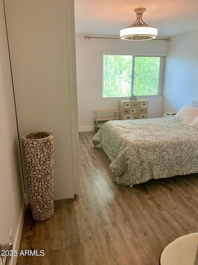 4610 N 68th St N Unit 476, Scottsdale, AZ 85251 - bedroom featuring wood finished floors and baseboards