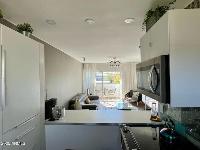 4610 N 68th St N Unit 476, Scottsdale, AZ 85251 - kitchen featuring stainless steel microwave and recessed lighting