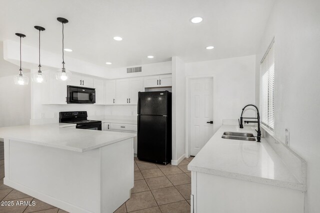 kitchen featuring a sink, a peninsula, light tile patterned floors, visible vents, and black appliances