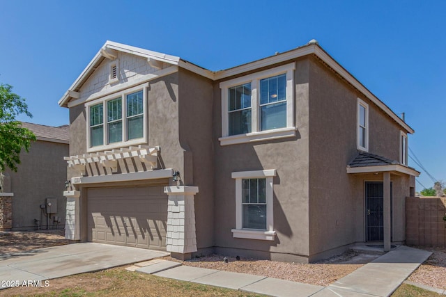 traditional-style house with stucco siding, driveway, a garage, and fence
