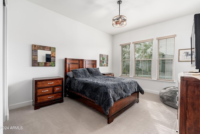 bedroom featuring light colored carpet