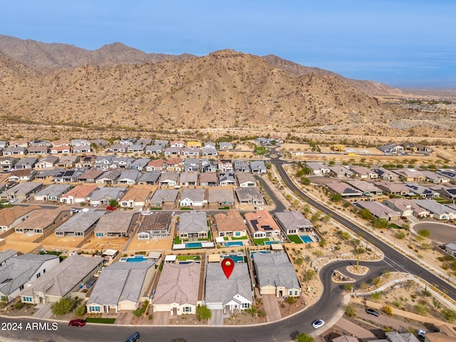 birds eye view of property with a mountain view