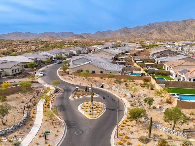 birds eye view of property with a mountain view