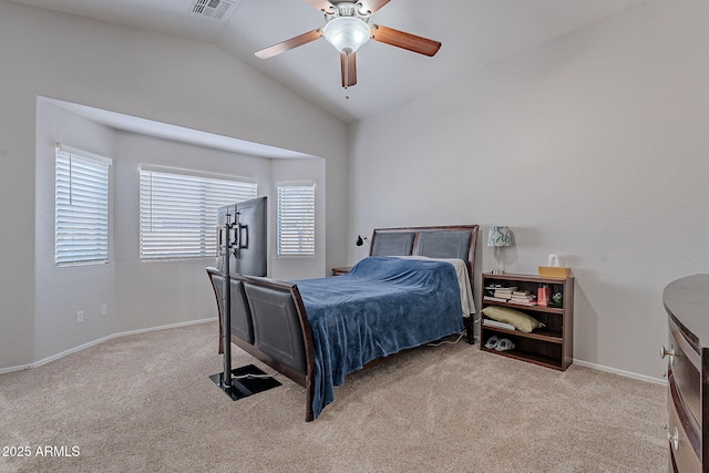 bedroom with vaulted ceiling, light carpet, and ceiling fan