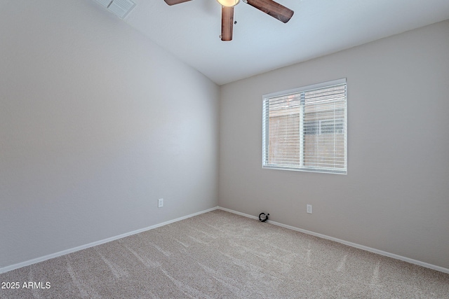 carpeted spare room with ceiling fan and lofted ceiling