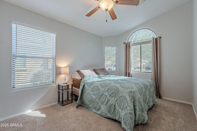 carpeted bedroom with lofted ceiling and ceiling fan