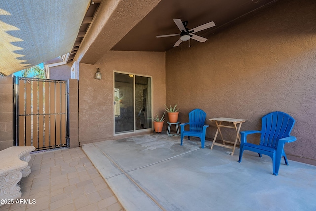 view of patio / terrace featuring ceiling fan